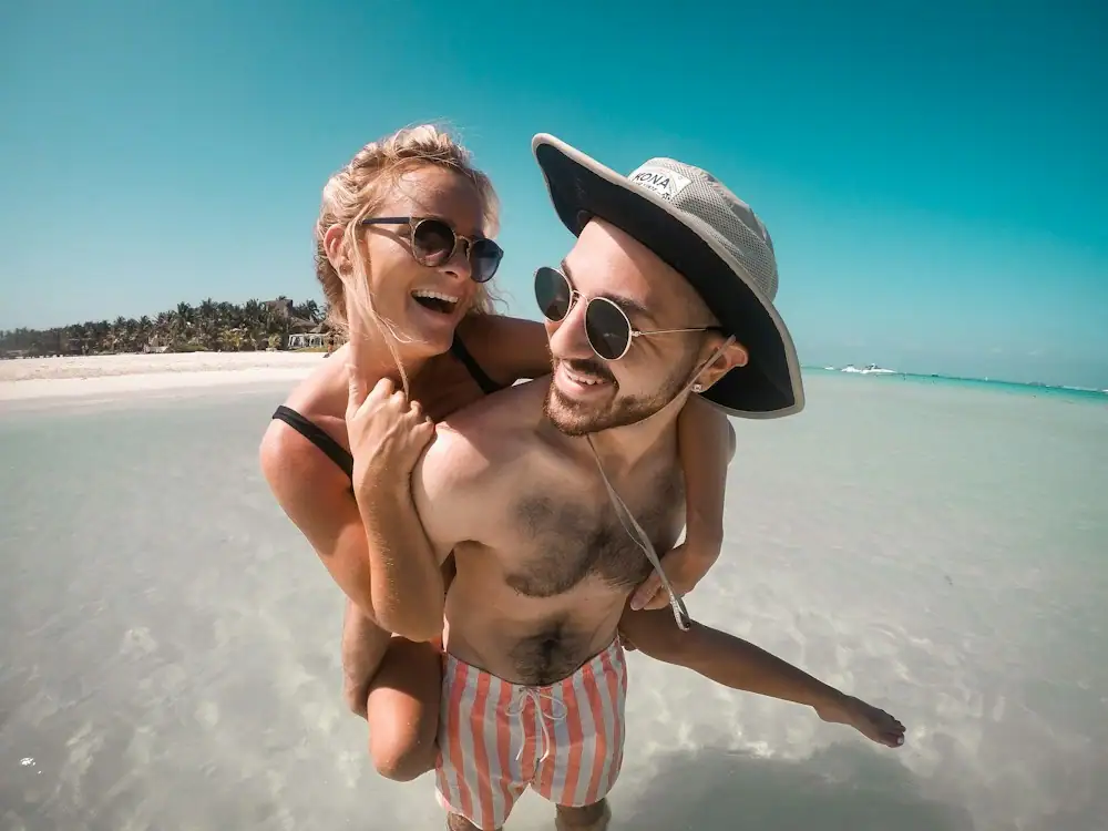 Happy couple enjoying a beach holiday
